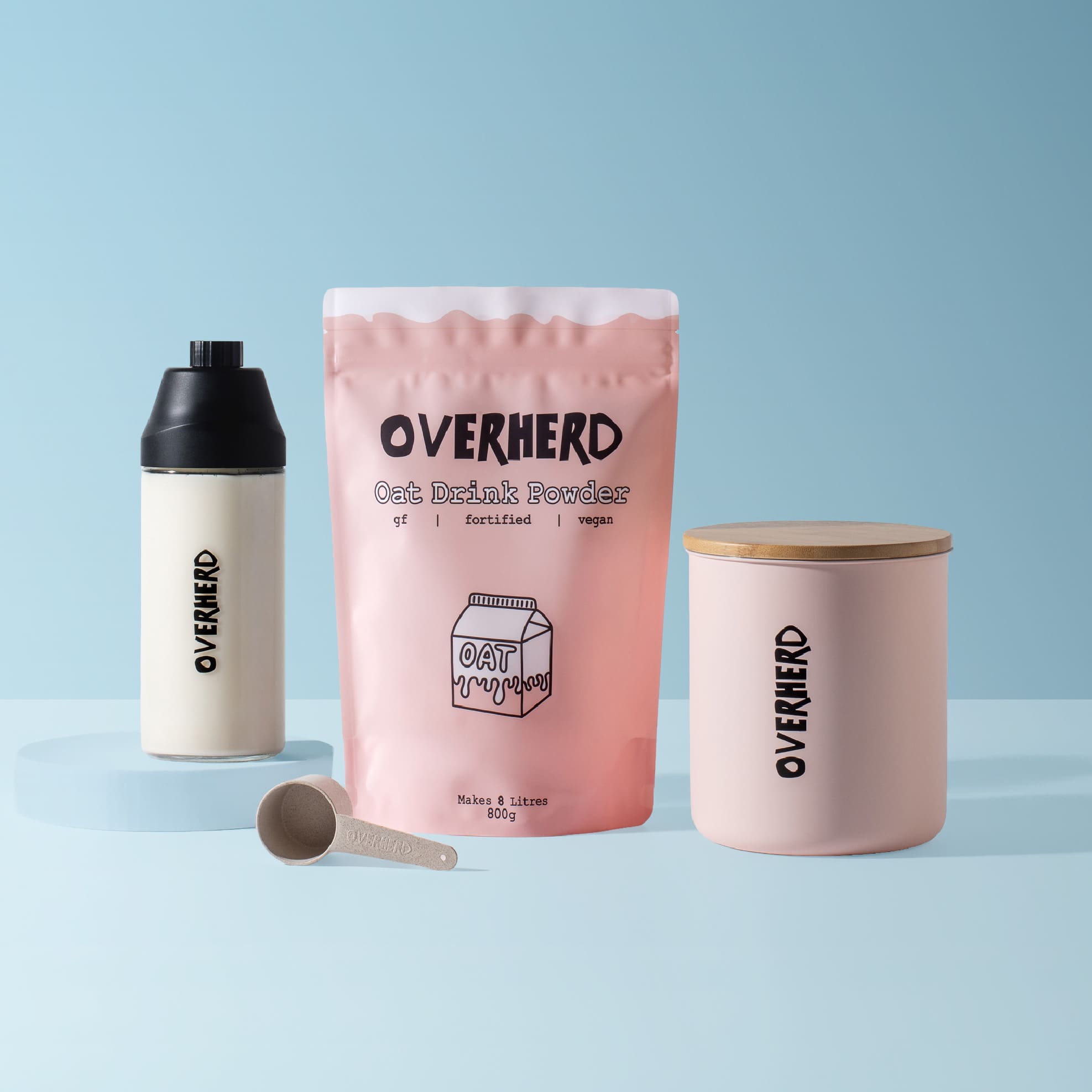 Overherd oat milk powder home bundle on light blue background