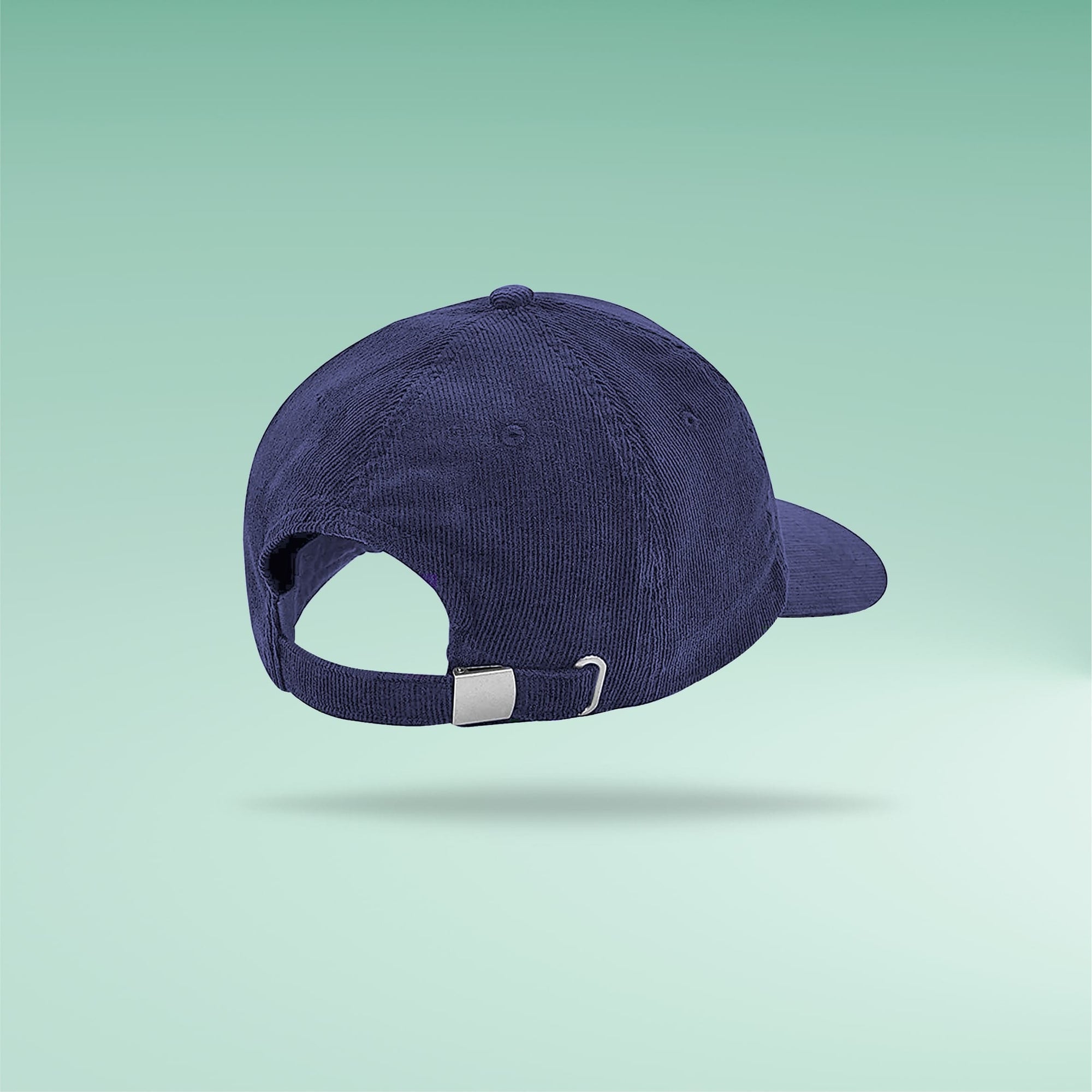 Overherd navy corduroy cap side view on green gradient background