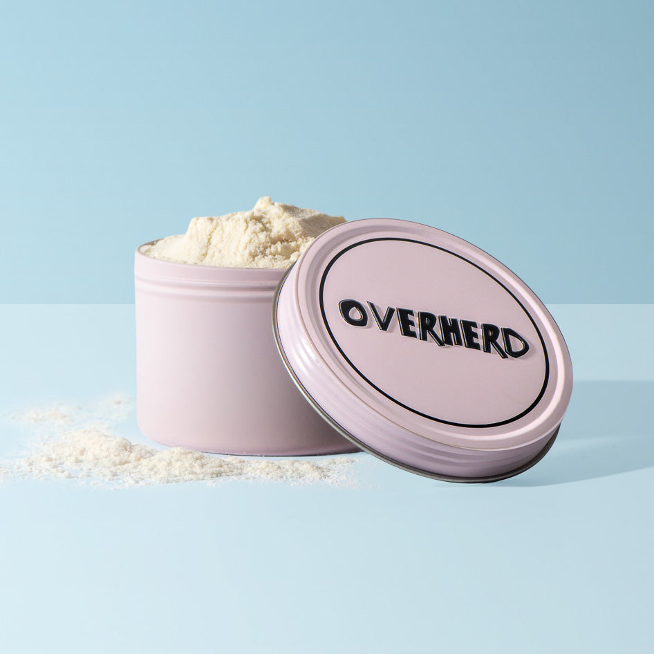 Overherd travel tin with powder in blue background