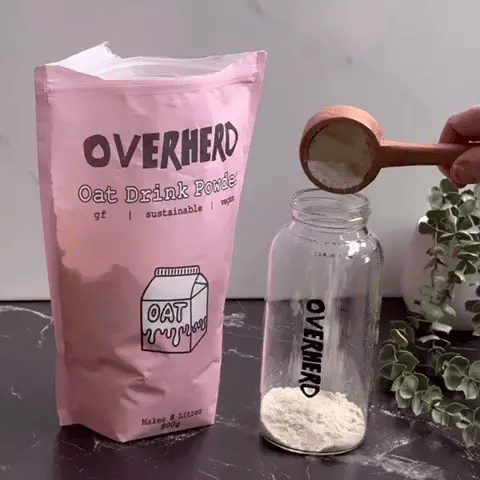 Powdered oat milk mixing with water